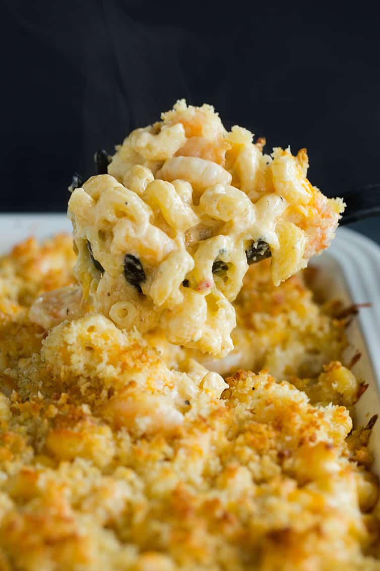 Scooping up a big helping of Cajun shrimp macaroni and cheese.