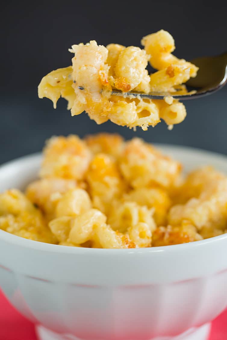 Taking a big bite of Cajun shrimp macaroni and cheese.