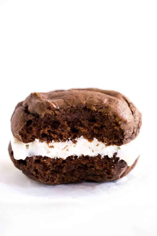 A big bite taken out of a chocolate gob cookie