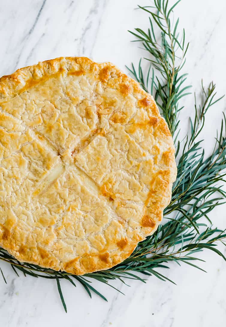 An overhead shot of baked Italian Easter Pie, garnished with rosemary.