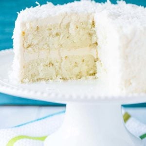 Coconut-Vanilla Bean Cake with Coconut Meringue Buttercream Frosting - A super moist coconut-packed layer cake and that frosting is a DREAM!