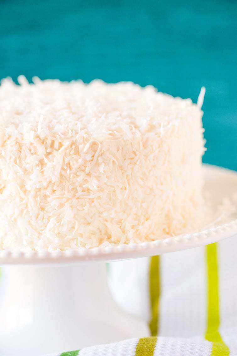 Coconut-Vanilla Bean Cake with Coconut Meringue Buttercream Frosting - A super moist coconut-packed layer cake and that frosting is a DREAM!