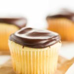 Boston Cream Cupcakes - Vanilla cupcakes filled with pastry cream and topped with chocolate ganache.