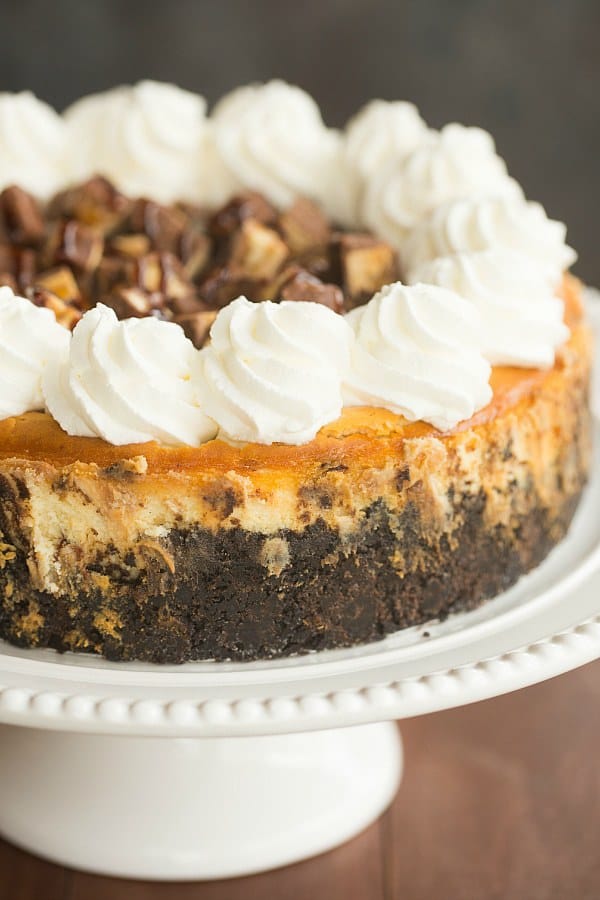Snickers Cheesecake | browneyedbaker.com #recipe