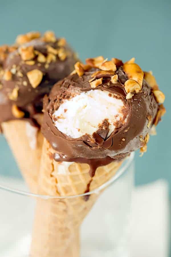DIY: Homemade Drumsticks... Complete with a chocolate-coated sugar cone filled with vanilla ice cream, dipped in chocolate and rolled in peanuts! | browneyedbaker.com