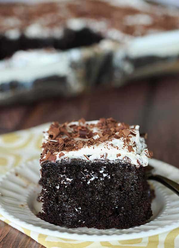 Mudslide Poke Cake - Chocolate cake infused with sweetened condensed milk, hot fudge, vodka, Kahlua and Baileys Irish Cream. An easy, delicious cake with a nice kick! | browneyedbaker.com