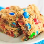 Monster Cookie Bars - Peanut butter dough is loaded with oats, chocolate chips and M&M's. | https://apex-male.info/monster-cookie-bars/