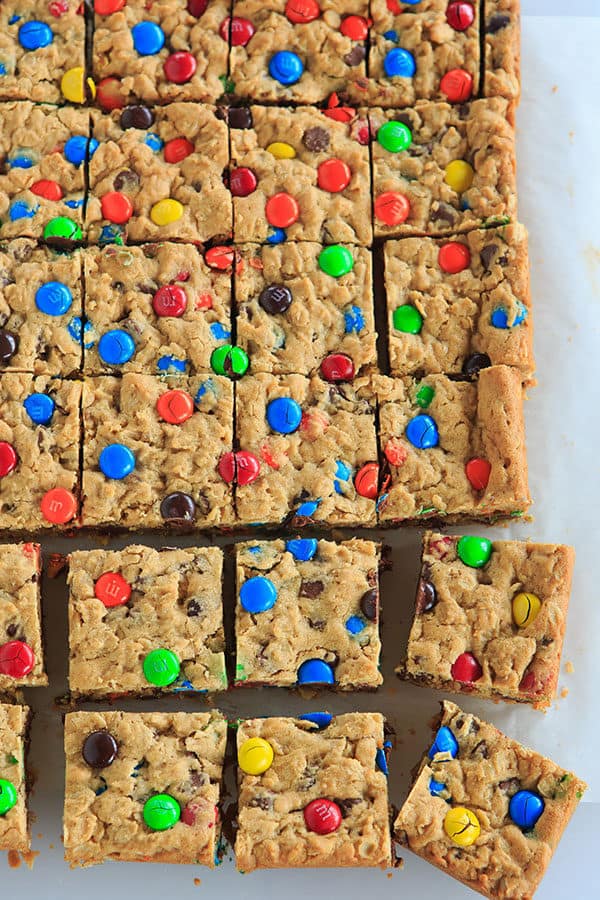 Monster Cookie Bars - Peanut butter dough is loaded with oats, chocolate chips and M&M's. | https://apex-male.info/monster-cookie-bars/