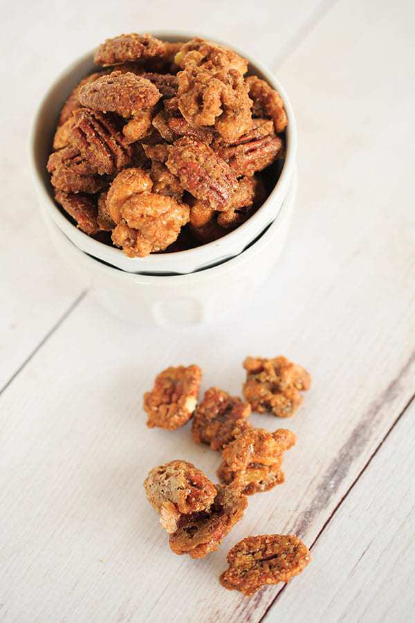 Sugar and Spiced Candied Nuts - These sweet and spicy candied nuts are sweet with a punch of cinnamon and a hint of spice. Perfect for holiday cocktail parties or hostess gifts! | https://apex-male.info/sugar-and-spice-candied-nuts/