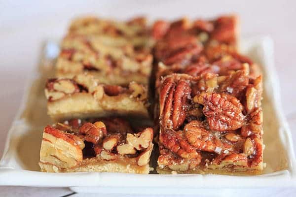 Ultranutty Pecan Bars - A shortbread crust acts as the base for these pecan bars that have a high nuts to filling ratio | browneyedbaker.com
