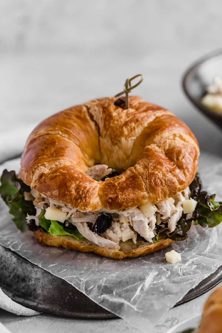 A chicken salad sandwich on croissant.