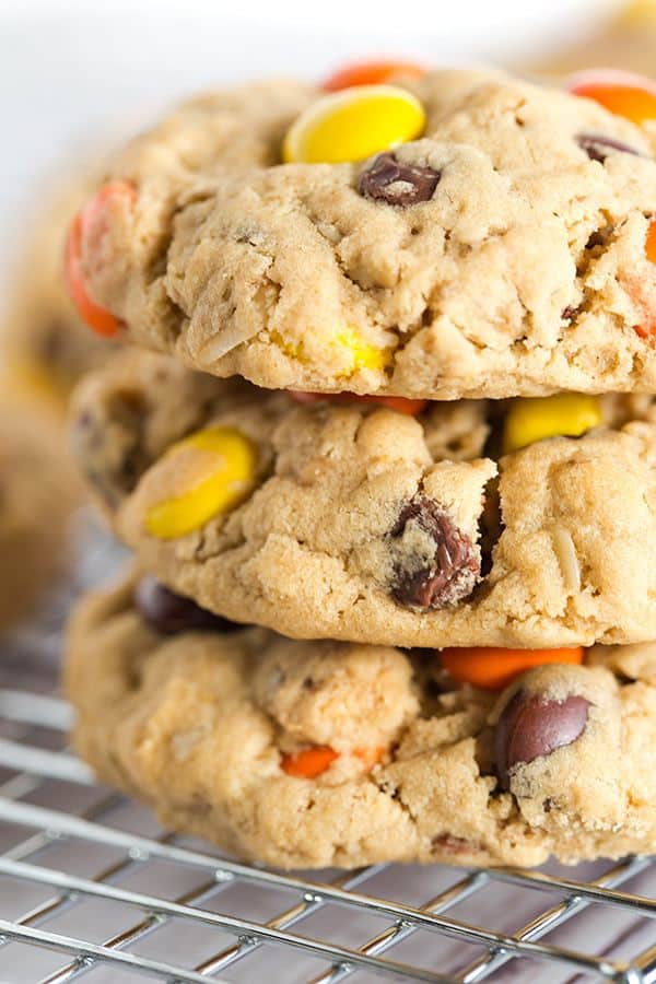 Peanut Butter Lover's Monster Cookies - A peanut butter dough loaded with oats, chocolate chips, peanut butter chips and Reese's Pieces! Go bake these NOW! | browneyedbaker.com