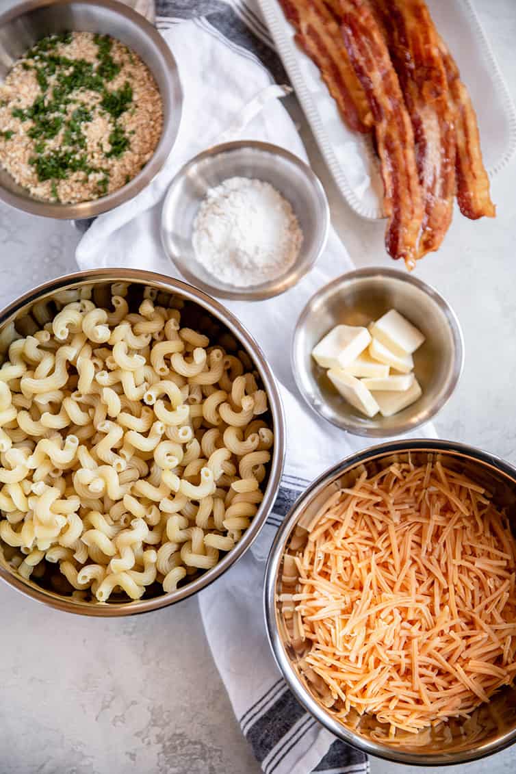 Ingredients for baked mac and cheese prepped in bowls.