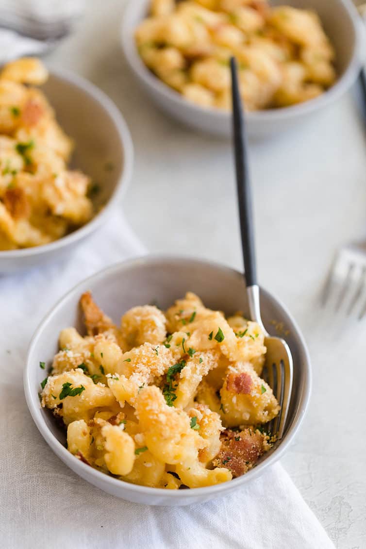 Three bowls of baked mac and cheese.