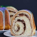 A festive King Cake for Mardi Gras - filled with a pecan, brown sugar and cinnamon swirl - baked into a Bundt pan and decorated with colored sanding sugars.