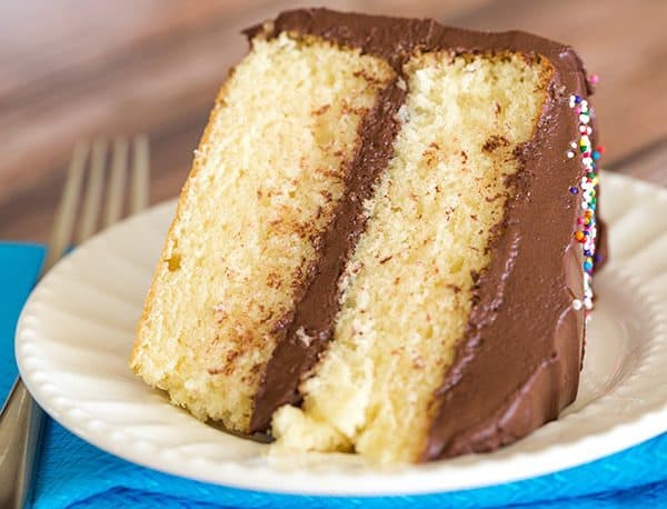 An easy, homemade yellow cake recipe that's buttery and moist, filled and frosted with the best chocolate frosting!