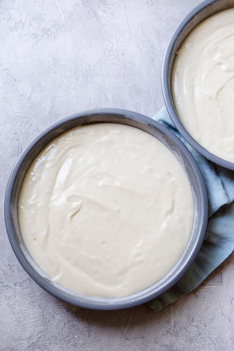 Prepared cake batter in pans.