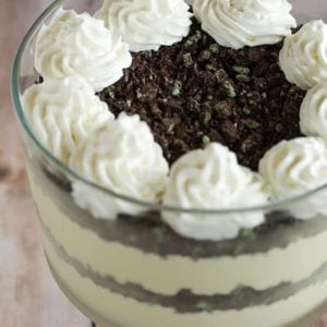 Baileys White Chocolate Mousse - Spiked white chocolate mousse layered into a trifle dish with crushed mint Oreos. An easy dessert for your St. Patrick's Day celebration!