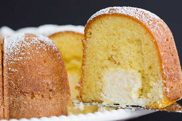 Twinkie Bundt Cake - This homemade Bundt version of the popular Twinkie dessert features a vanilla pound cake with a tunnel of that glorious cream filling!