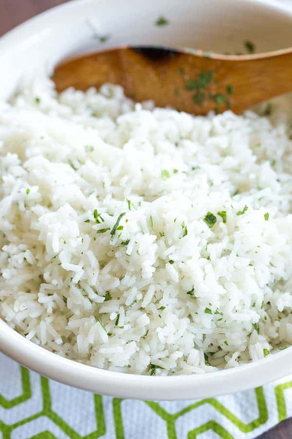 A copycat recipe for Chipotle's popular cilantro-lime rice, with a simple method to ensure light, fluffy rice with no clumps!