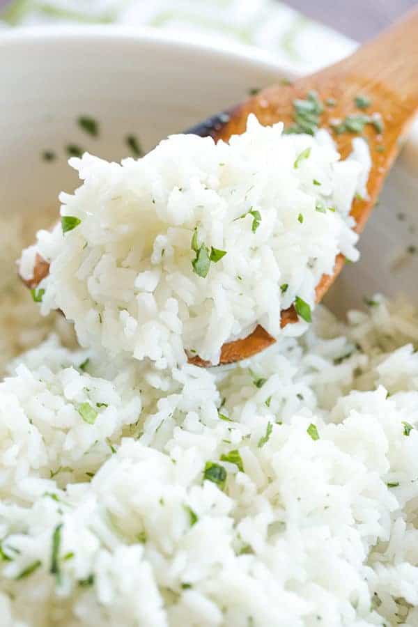 A copycat recipe for Chipotle's popular cilantro-lime rice, with a simple method to ensure light, fluffy rice with no clumps!