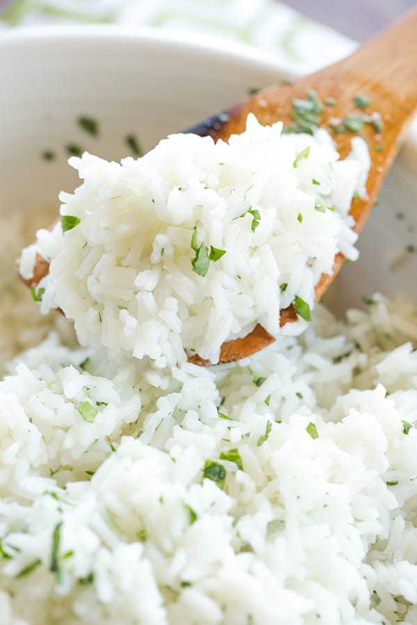 A copycat recipe for Chipotle's popular cilantro-lime rice, with a simple method to ensure light, fluffy rice with no clumps!