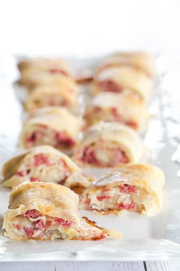 These reuben rolls feature pizza crust stuffed with corned beef, Swiss cheese, sauerkraut and a caraway-seed dressing. They will disappear in a matter of minutes!