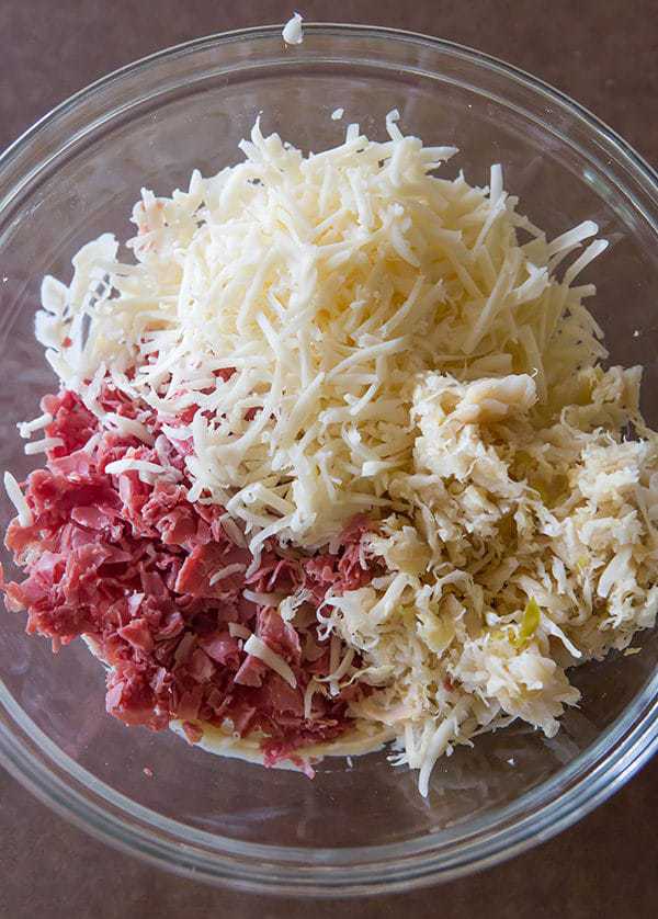 These reuben rolls feature pizza crust stuffed with corned beef, Swiss cheese, sauerkraut and a caraway-seed dressing. They will disappear in a matter of minutes!