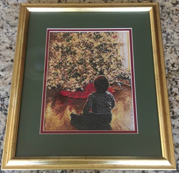 Cross-stitch done by my aunt of our Christmas card!