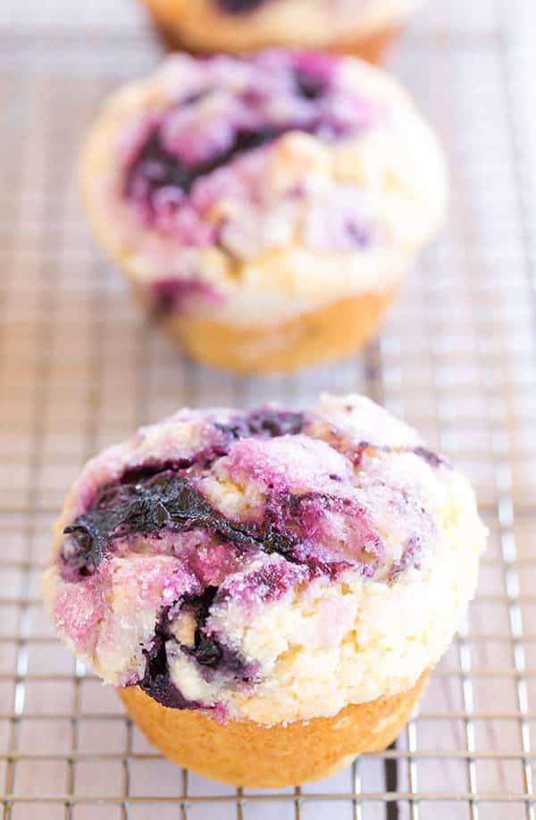 These blueberry muffins are loaded with fresh blueberries, have a fresh blueberry jam swirl throughout and are topped with sugar for a crunchy bite!
