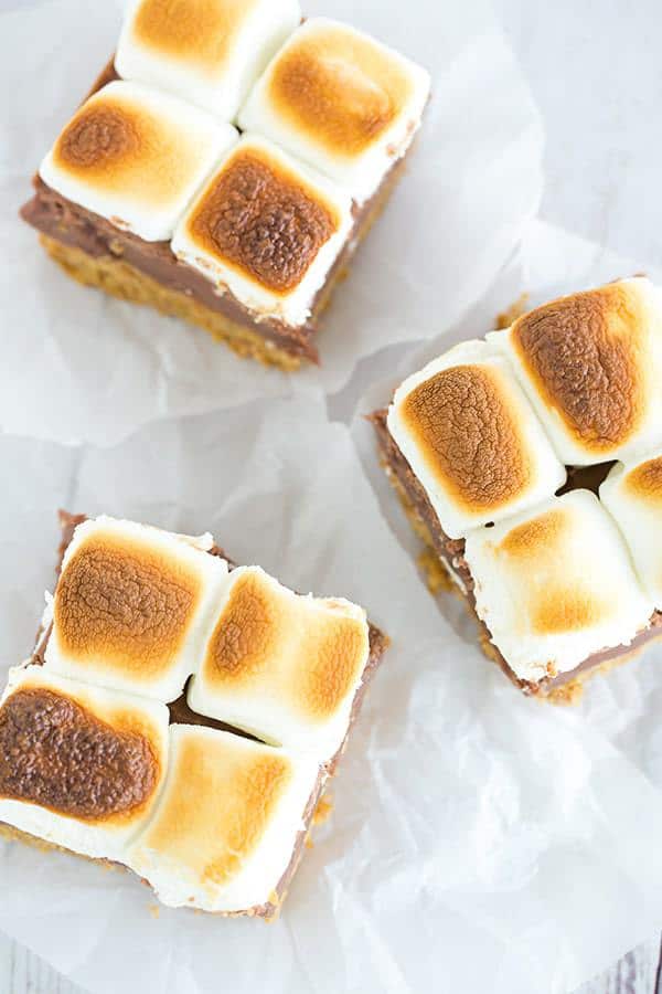 These s'mores bars boast a thick graham crust, a fudgy milk chocolate layer, and are topped with toasted marshmallows, of course!