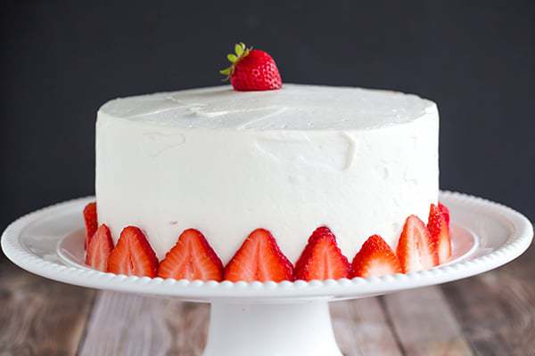 Strawberry Poke Cake - A two-layer beauty with the most amazing fresh sweet whipped cream. A perfect summer celebration cake!