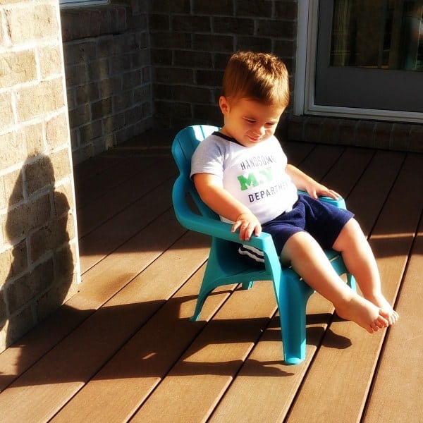 Joseph lounging on the deck in his little adirondack chair.
