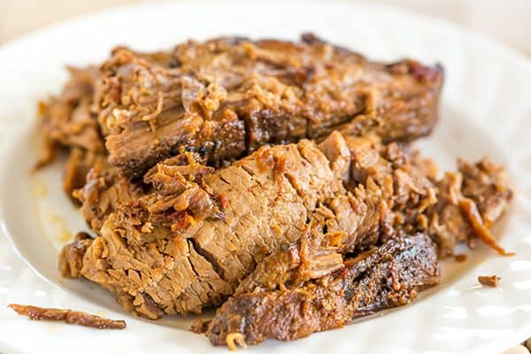 This slow cooker beef brisket is incredibly easy, cooks itself, and full of flavor thanks to the simple homemade barbecue sauce!