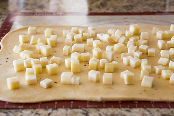 Spicy Cheese Bread - This recipe makes a huge loaf of a rich brioche-like bread loaded with provolone and Monterey Jack cheeses, and speckled with crushed red pepper flakes. | browneyedbaker.com