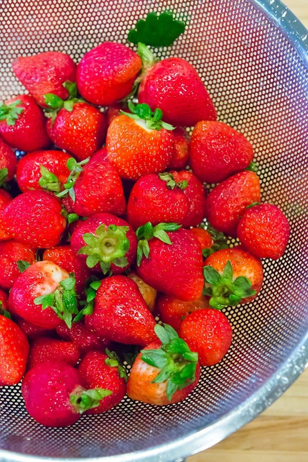 Cobbler-style biscuits are nestled on top of fresh strawberry jam and baked until bubbling and golden. A wonderful summer dessert!