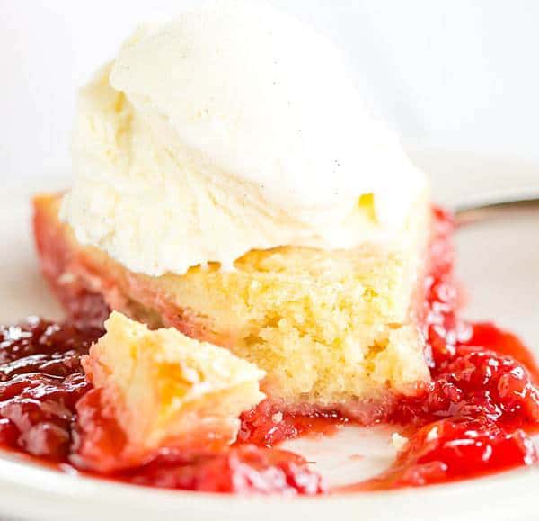 Cobbler-style biscuits are nestled on top of fresh strawberry jam and baked until bubbling and golden. A wonderful summer dessert!