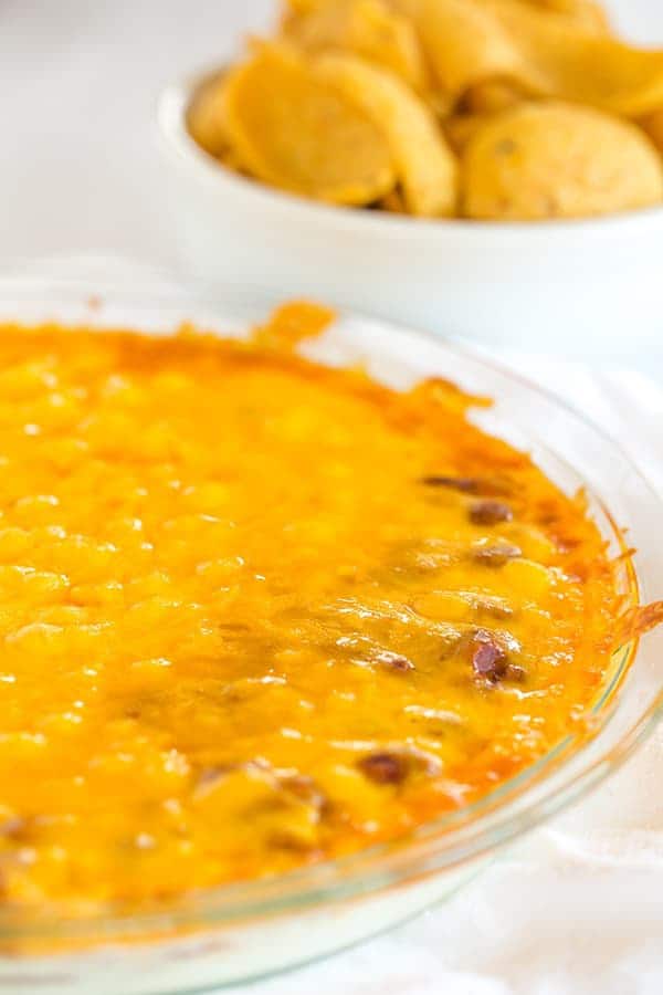 This Cheesy Chili Dip is incredibly easy and perfect for parties, cookouts or watching the game. Only THREE ingredients!! 