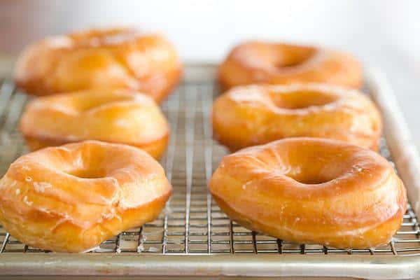 A copycat recipe for Krispy Kreme doughnuts - they're light, airy and covered in a barely-there glaze.