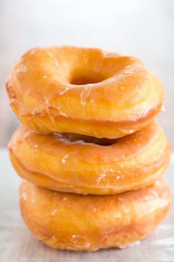 A copycat recipe for Krispy Kreme doughnuts - they're light, airy and covered in a barely-there glaze.