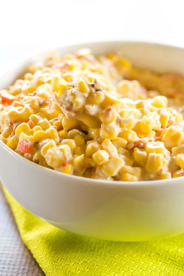This creamy corn salad has Mexican flair, tons of flavor, and a big kick thanks to the addition of green chiles! A perfect side dish for summer parties!