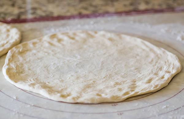 This Neapolitan pizza crust is thin, crispy and has the most amazing flavor. My homemade pizza-making is forever changed!