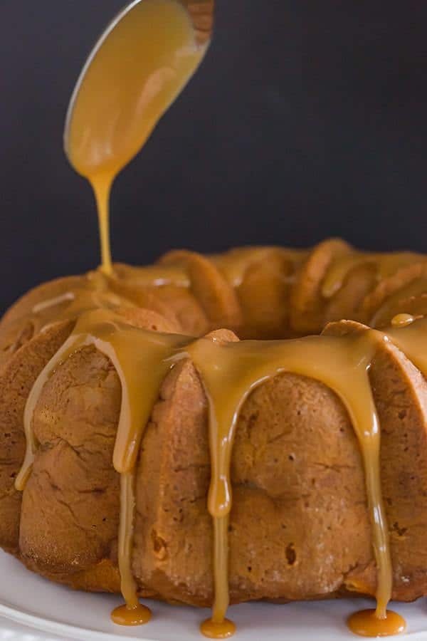 Caramel Apple Bundt Cake - An easy cake recipe baked up in a gorgeous Bundt pan, and topped with a perfect caramel glaze.