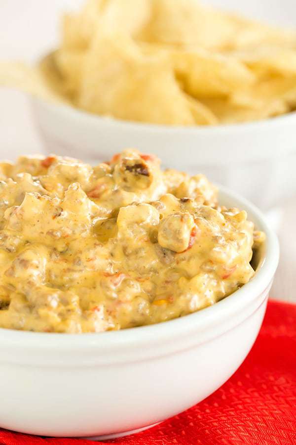This game day dip is perfect football food - only 5 ingredients and you throw them all in the slow cooker! An easy, cheesy dip!