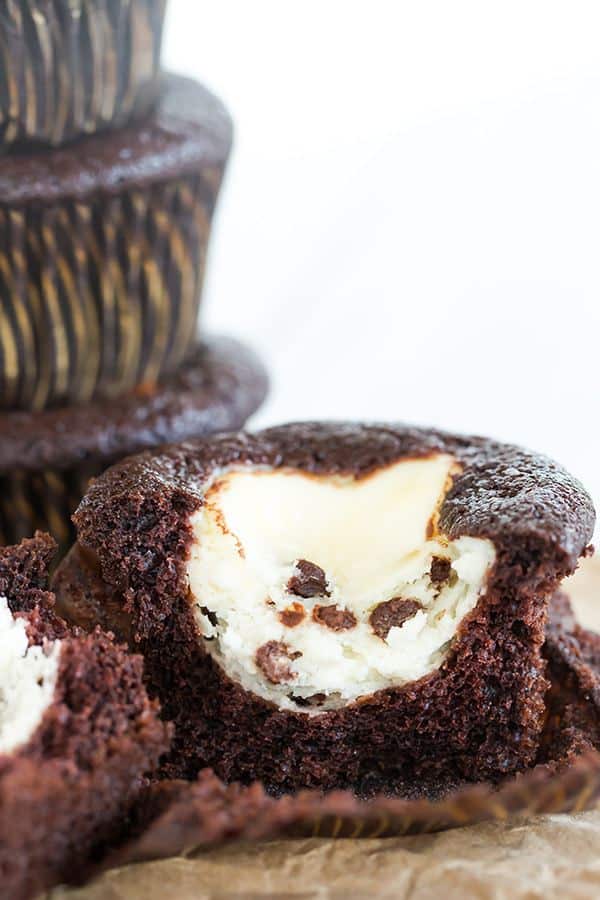 Classic black-bottom cupcakes - super moist chocolate cupcakes topped with a cheesecake filling and mini chocolate chips. The best of both worlds!