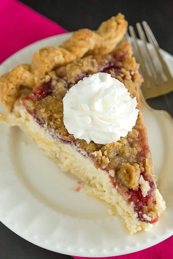 This Cranberry Cheesecake Crumb Pie features pie crust filled with a simple cheesecake batter, then topped with a thick cranberry sauce and crumb topping.