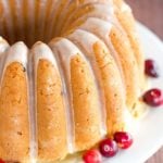 This Cranberry Pound Cake is wonderfully dense, moist and loaded with fresh cranberries. Topped with a simple orange glaze, it's perfect for the holidays.