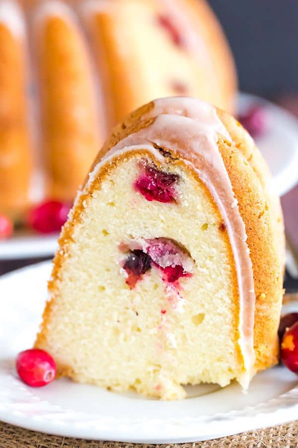 This Cranberry Pound Cake is wonderfully dense, moist and loaded with fresh cranberries. Topped with a simple orange glaze, it's perfect for the holidays.