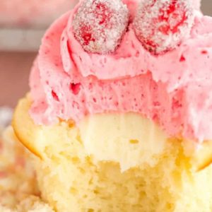 Sparkling Cranberry White Chocolate Cupcakes - Vanilla cupcakes with white chocolate ganache filling and cranberry buttercream frosting. | browneyedbaker.com