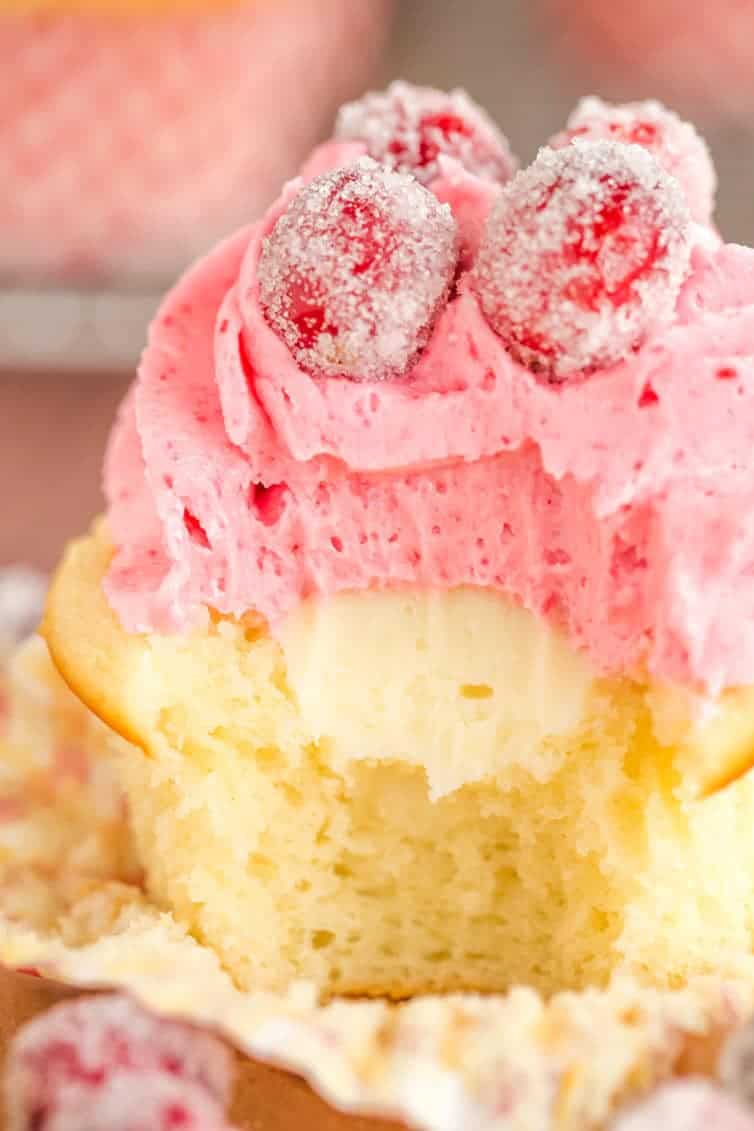 Sparkling Cranberry White Chocolate Cupcakes - Vanilla cupcakes with white chocolate ganache filling and cranberry buttercream frosting. | browneyedbaker.com